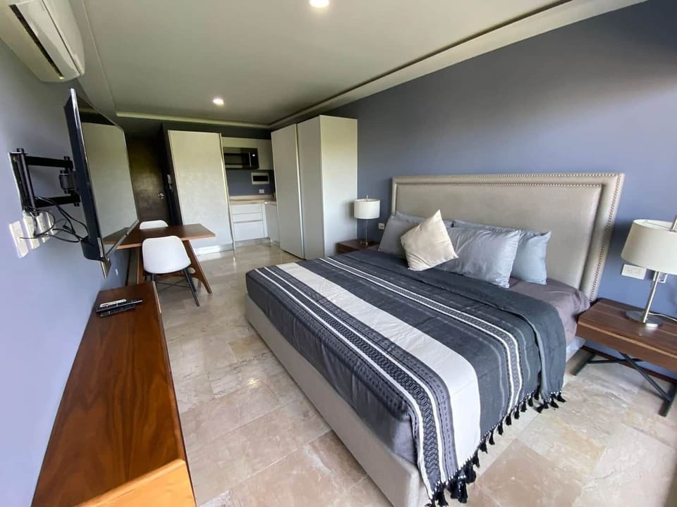 En el sitio,Alrededores,Area de estar,Área para café / té,Área y comodidades,Cama,Cocina o kitnet,Detalle decorativo,Foto de toda la habitación,TV y multimedia,Vista (de la propiedad / habitación)