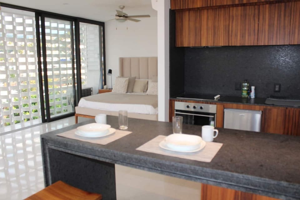 En el sitio,Area de estar,Área para café / té,Área y comodidades,Cama,Cocina o kitnet,Detalle decorativo,Foto de toda la habitación,Ubicación,Vista (de la propiedad / habitación)