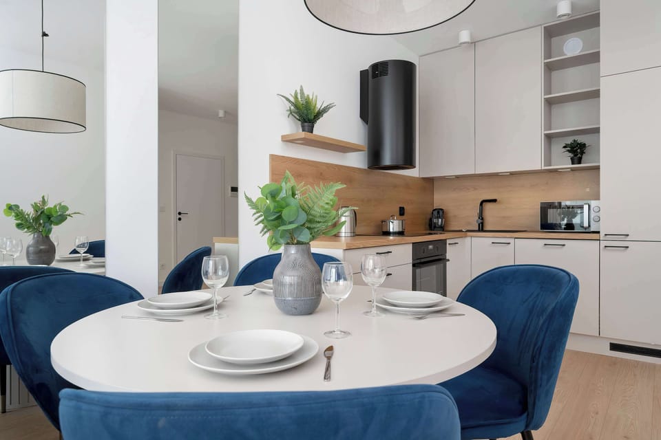 The elegant living room featuring a double sofa bed, perfect for relaxing or sleeping.