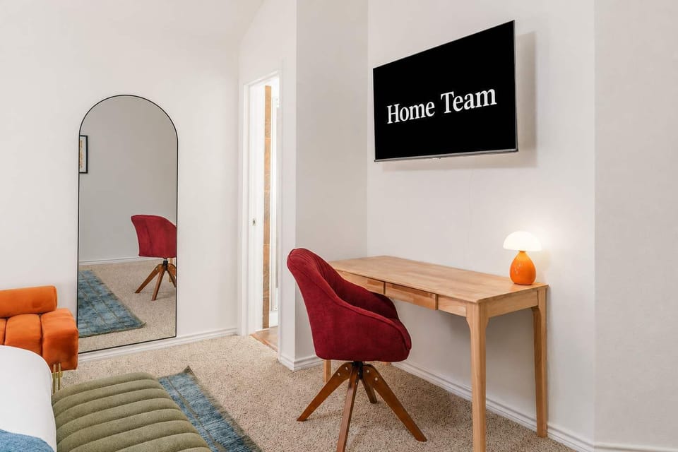 Whether you're working remotely or just getting ready for a night out  — this well-appointed bedroom has a dedicated desk, smart TV, and all the space you need. 