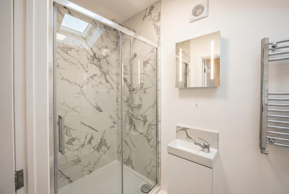 Walk in marble shower that feels like a spa morning