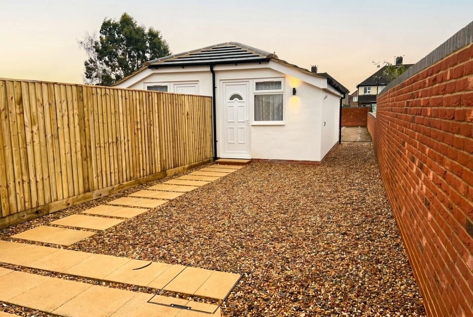 Secure gravel courtyard leading to your own front door