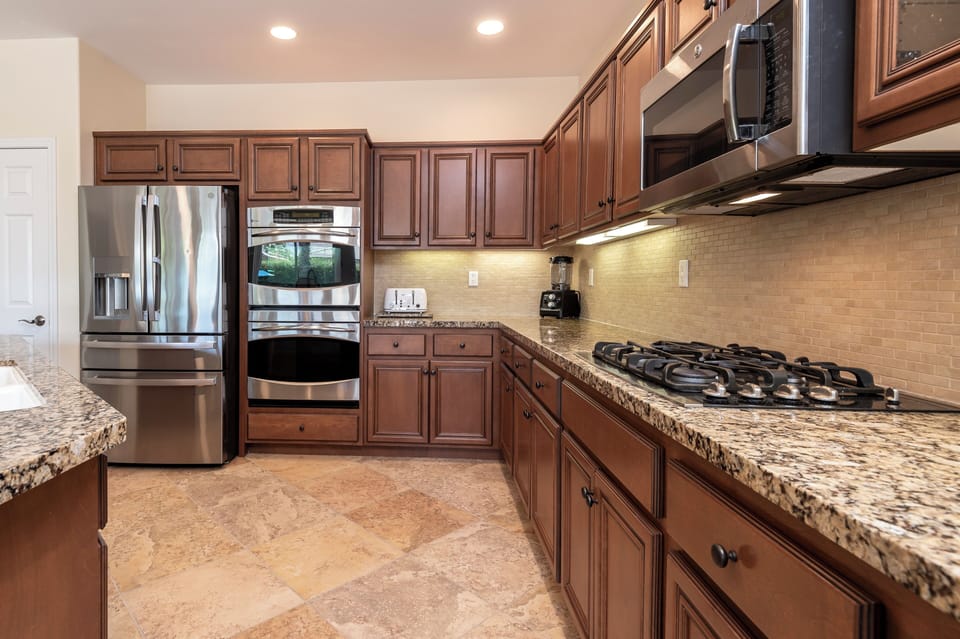 Gourmet Kitchen, French 4 door fridge, double ovens, gas range and microwave. 