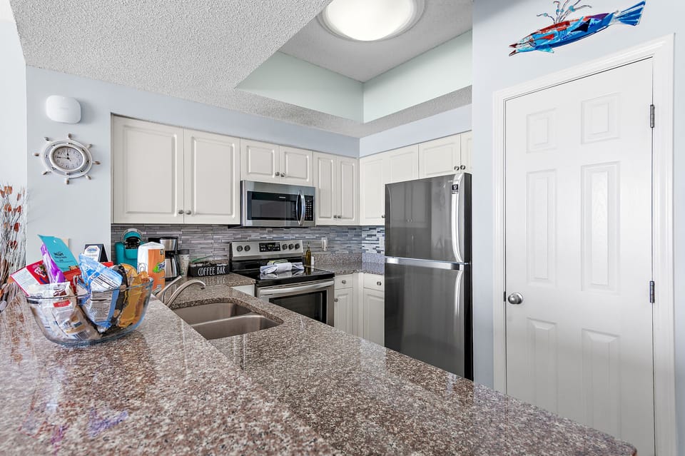 Kitchen has GULF VIEWS, granite countertops, stainless appliances - fully stocked with more than the basics (coffee/tea bar, oils/salt and pepper, plenty of pots/pans/cookware)