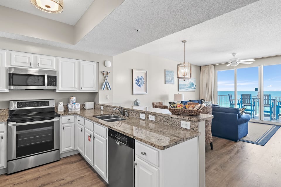 Kitchen has GULF VIEWS, granite countertops, stainless appliances - fully stocked with more than the basics (coffee/tea bar, oils/salt and pepper, plenty of pots/pans/cookware)