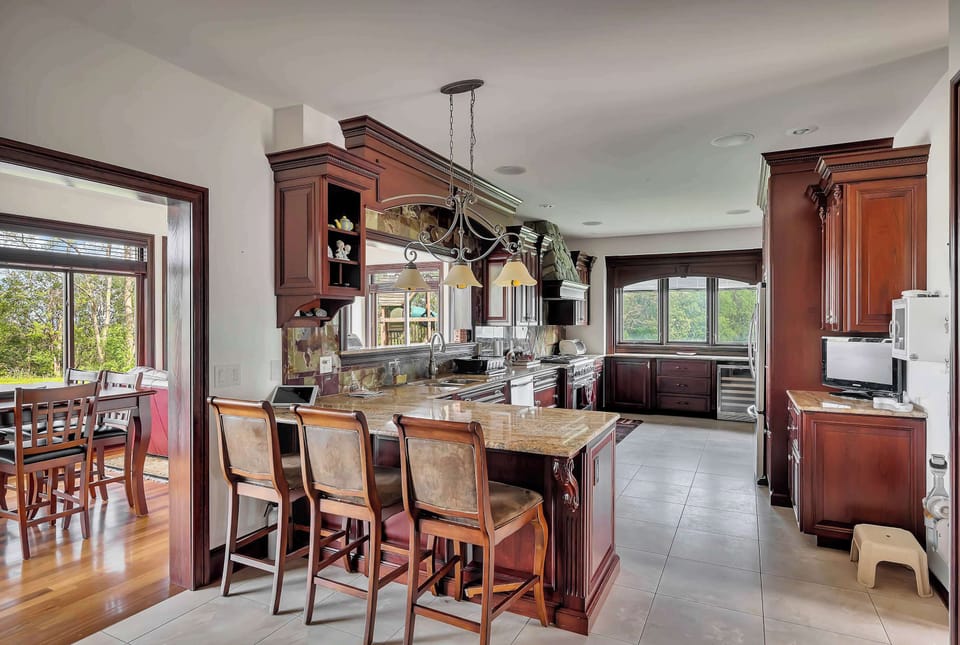 Main Level | Kitchen | Refrigerator | Double Oven | Wine Cooler | Microwave | Stove | Espresso Machine | Dishwasher