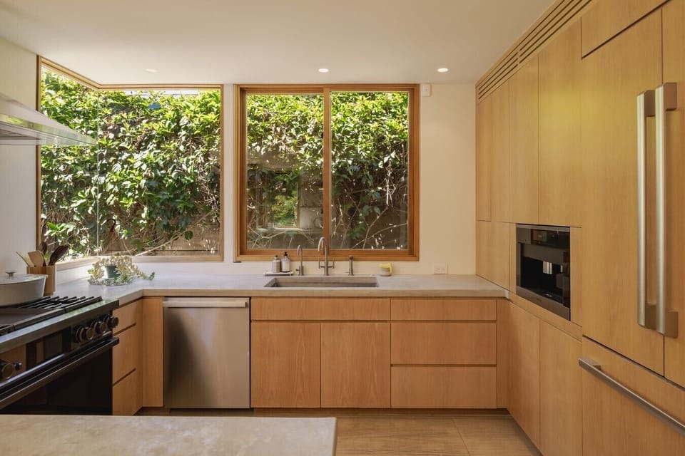 Cook with a view — the chef`s kitchen features a gas range, lush garden window, and everything you need to put together a proper meal.