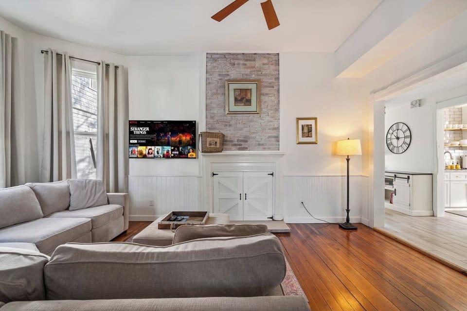 55" Smart TV and comfortable sectional — the perfect spot to unwind after a day downtown