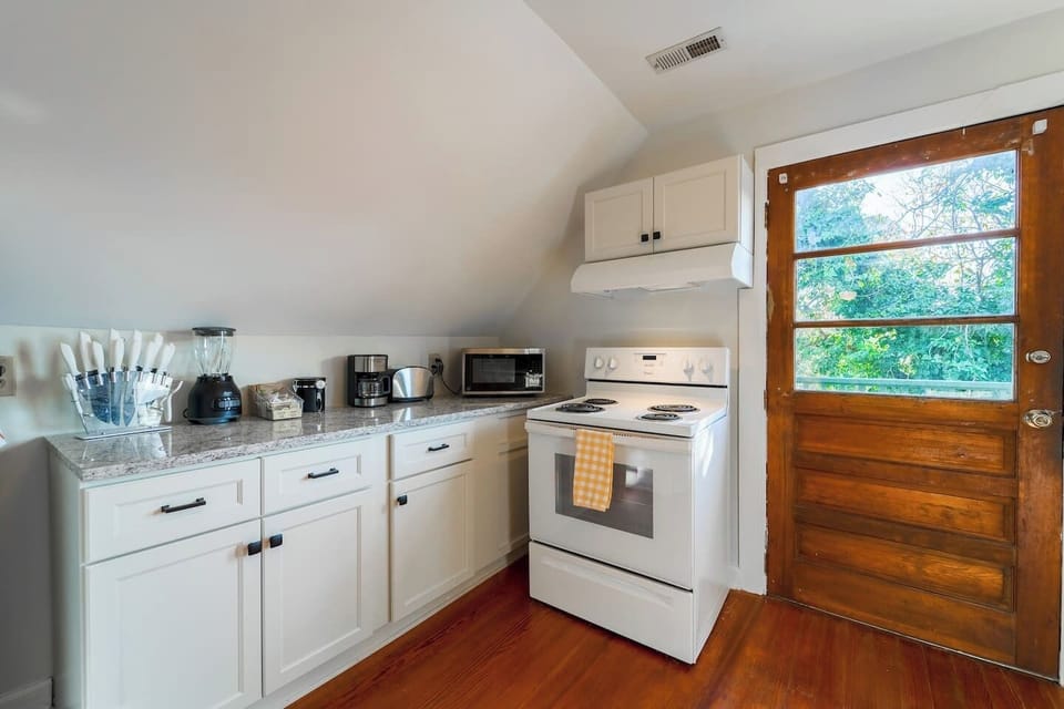 Newly renovated kitchen offers the comforts of home. Original wood door leads to a private deck off of the kitchen.