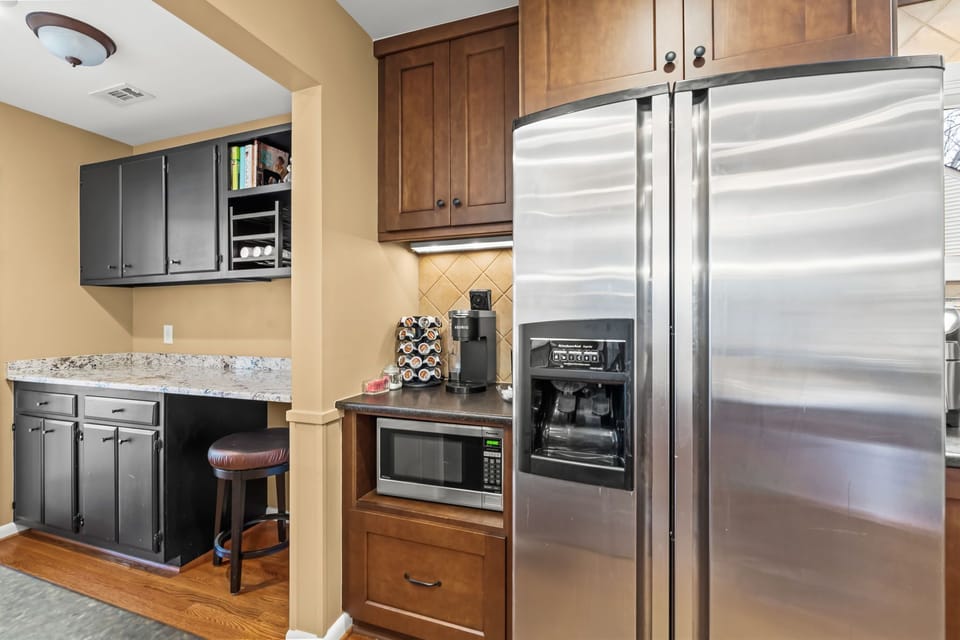 Double door refrigerator with ice and water, microwave, coffee & bar room