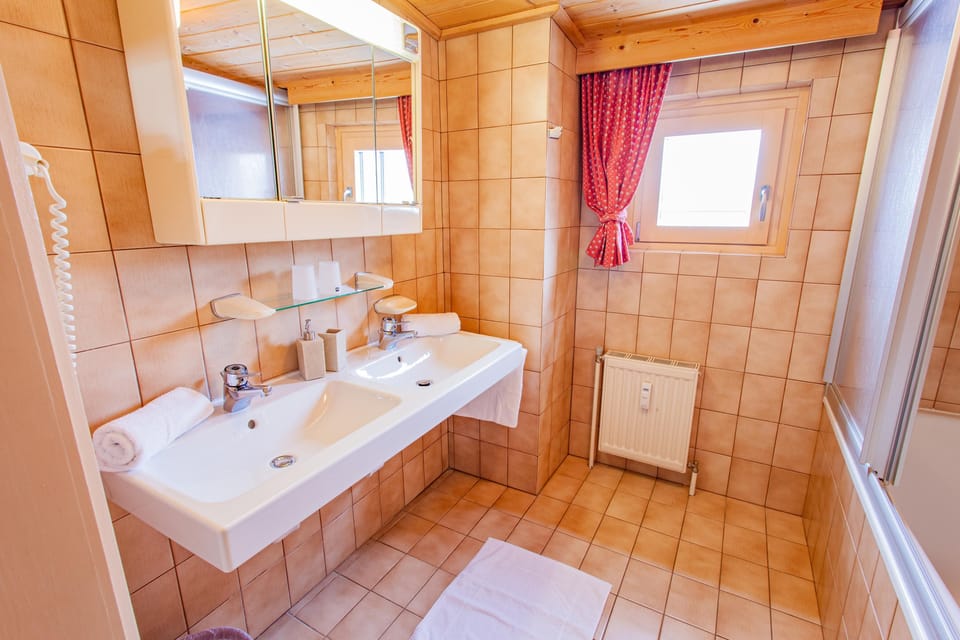 Bathroom with shower and bathtub