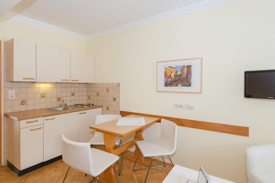 Kitchen with dining area and TV