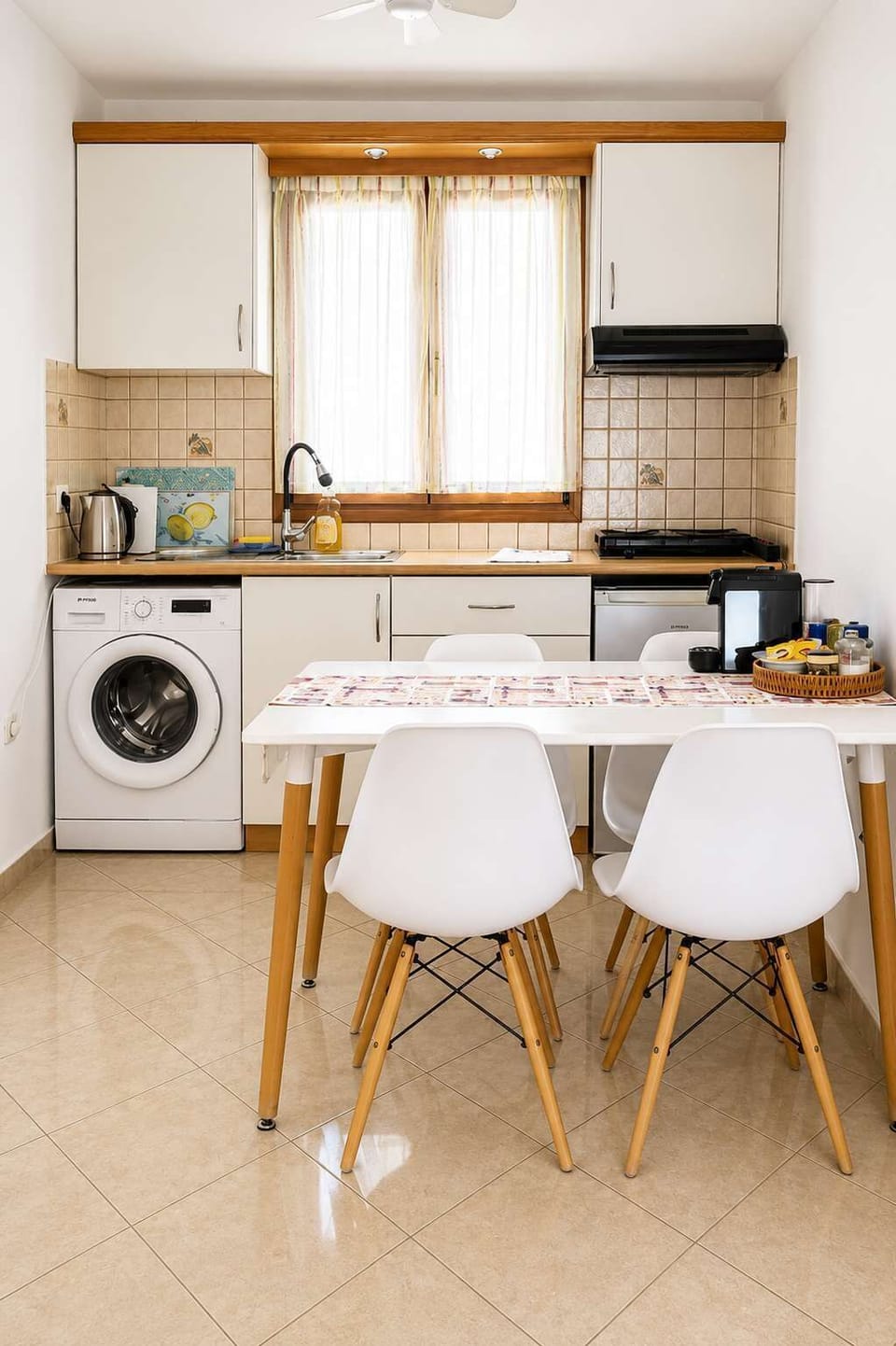Modern kitchenette with dining table for four