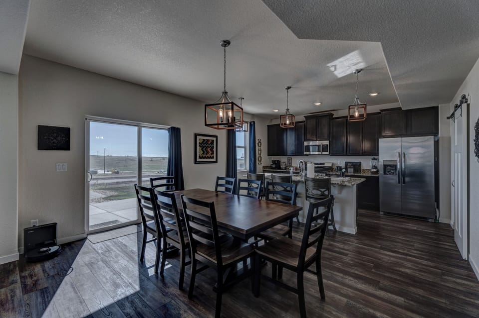 Seating for 11 (8 at the dining room table and 3 bar stools at the kitchen island)
