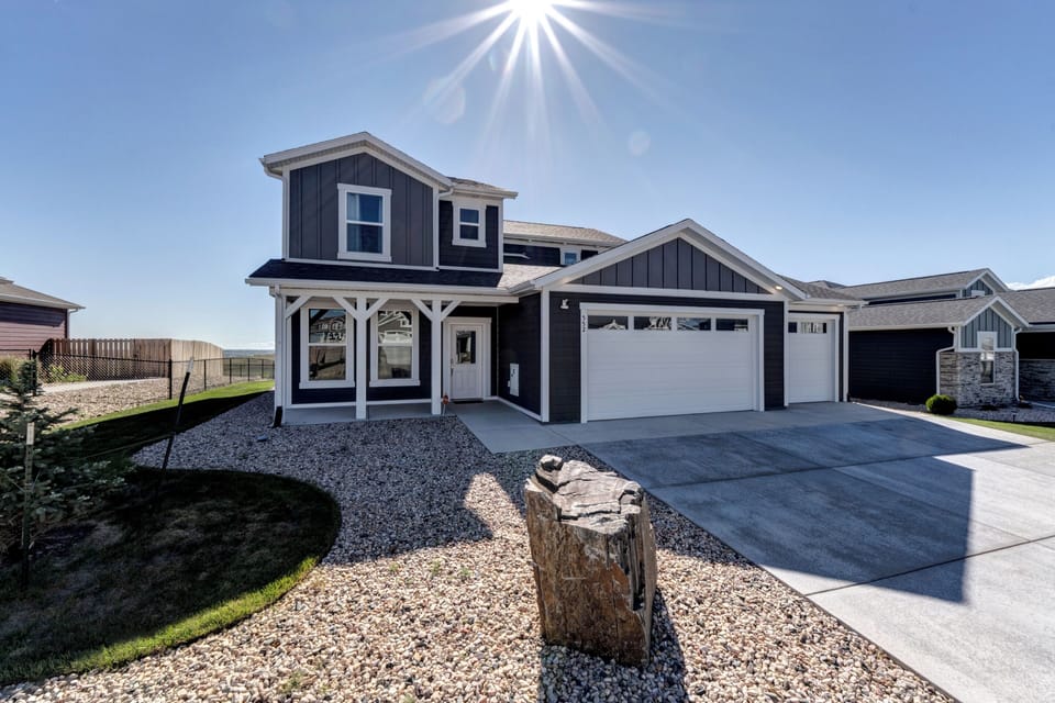 New house with beautifully landscaped yard in an upscale neighborhood