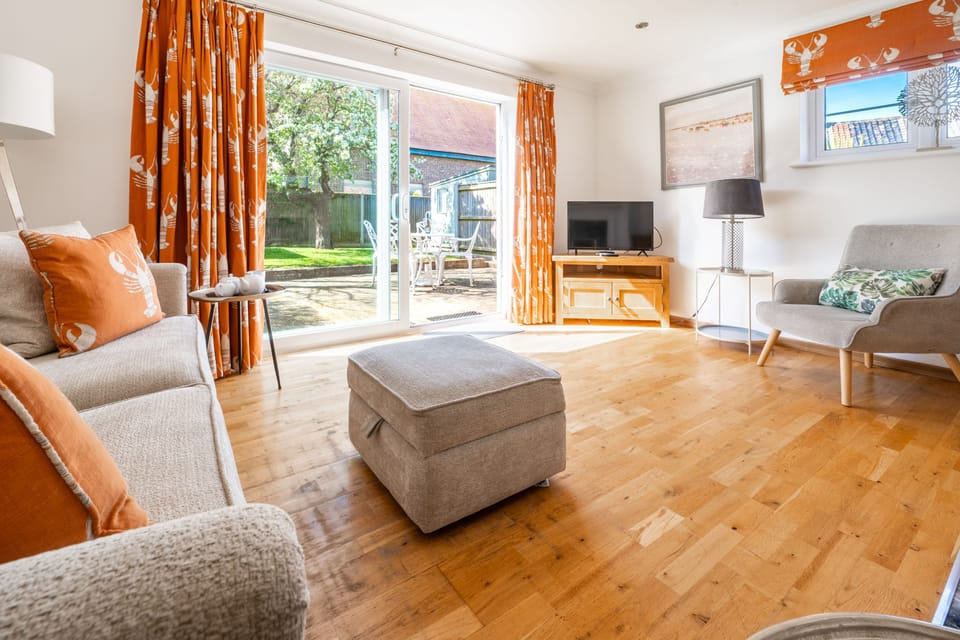 Ground floor: Sitting room with french doors to the garden