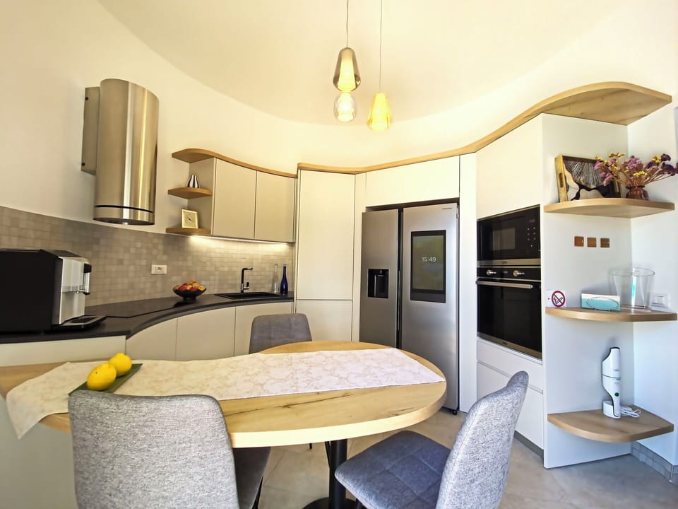 Furniture, Interior Design, Flooring, Wood, Ceiling, Kitchen, Floor, Countertop, Lighting, Room