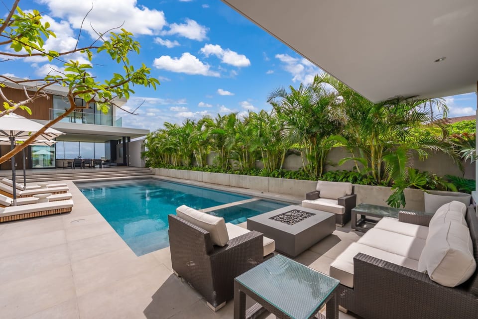Gather poolside with a cool drink and enjoy the privacy of your tropical surroundings.