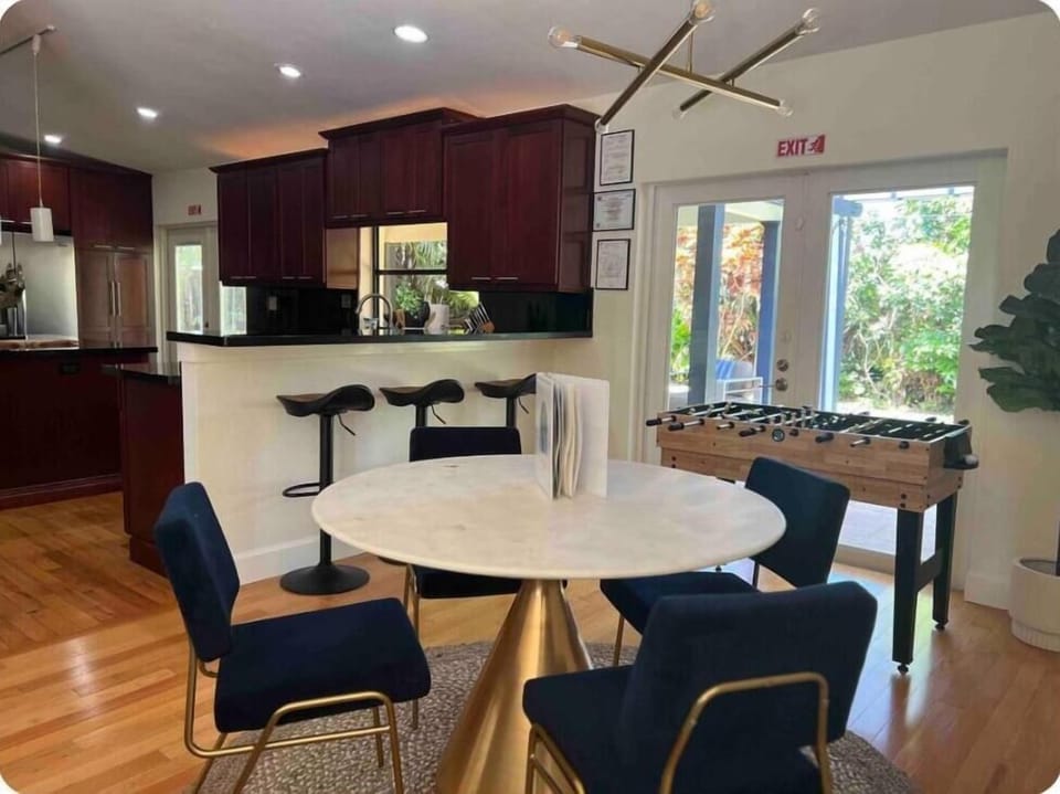 Modern dining area with foosball table & open kitchen