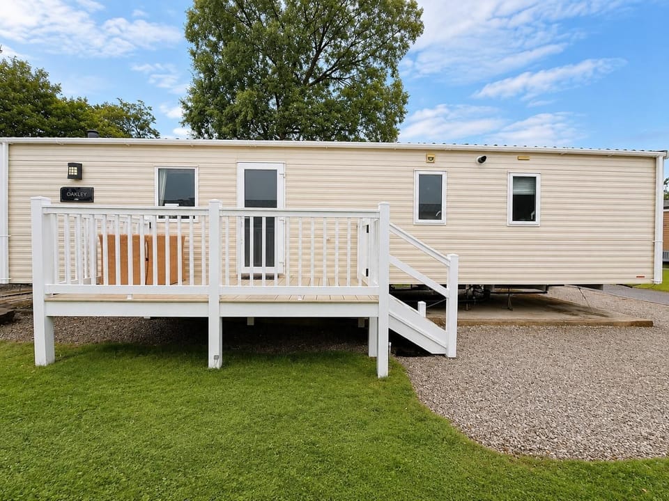 Step inside with ease. This bright white veranda and smart composite steps make coming and going simple, while the safety gate adds peace of mind.