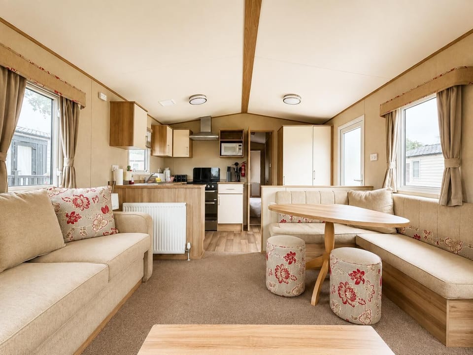 The spacious lounge in this caravan is perfect for after you kick your boots off and come in from your hike. Get together and plan your next adventure in the Dales.