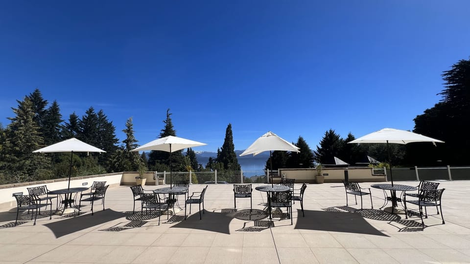 Sip morning coffee on the panoramic terrace under blue skies.
