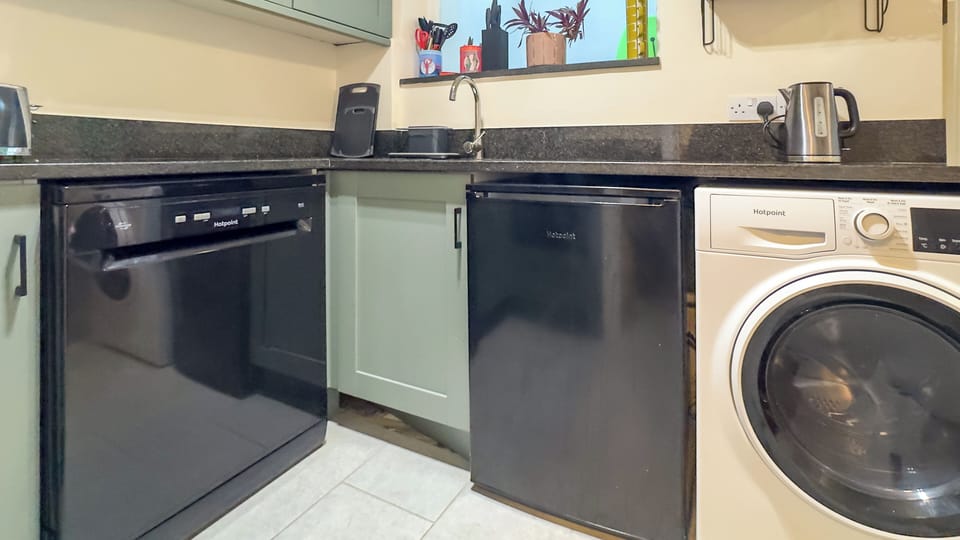 Fully equipped self-catering kitchen with modern appliances for effortless home cooking.
