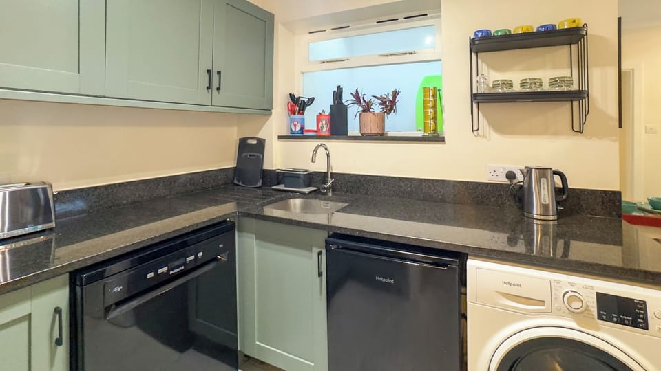 Modern self-catering kitchen offering all the essentials for cooking and dining with ease.