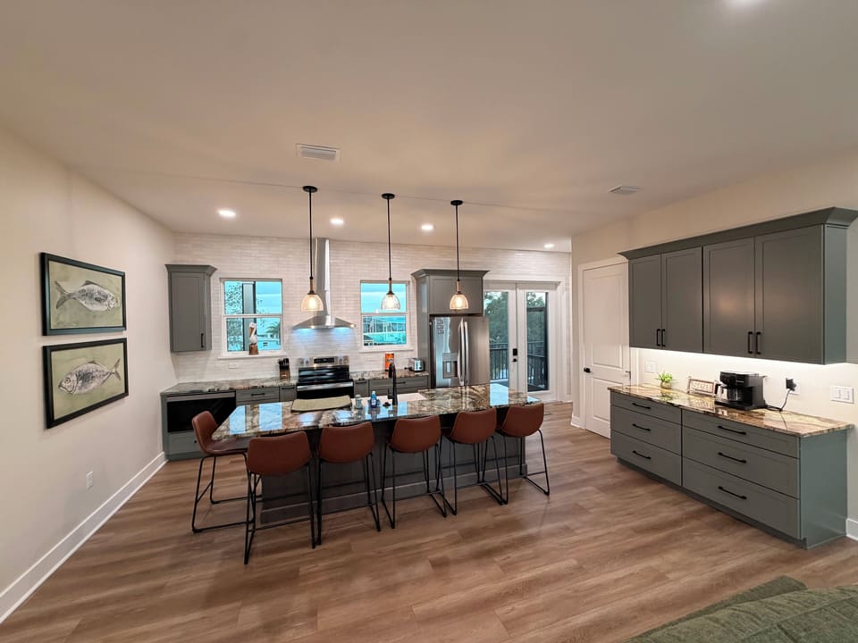 Fully stocked kitchen, oven, microwave, dishwasher, fridge, coffee maker