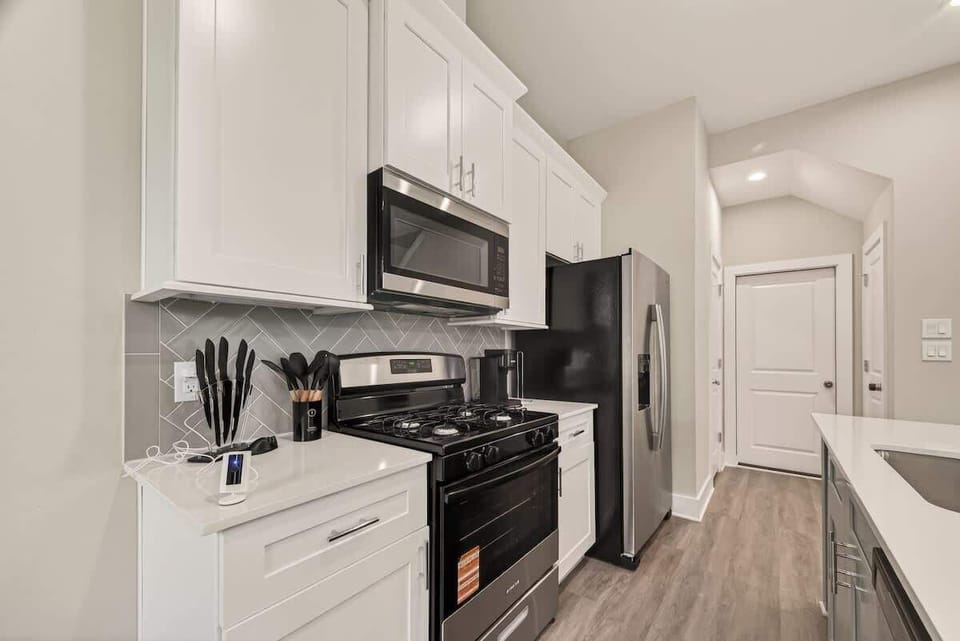 Bright open kitchen with spacious island, bar seating, and everything you need for home-cooked meals.
