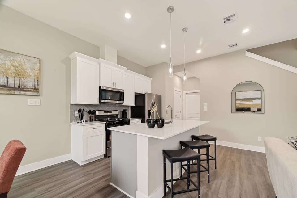 Bright open kitchen with spacious island, bar seating, and everything you need for home-cooked meals.