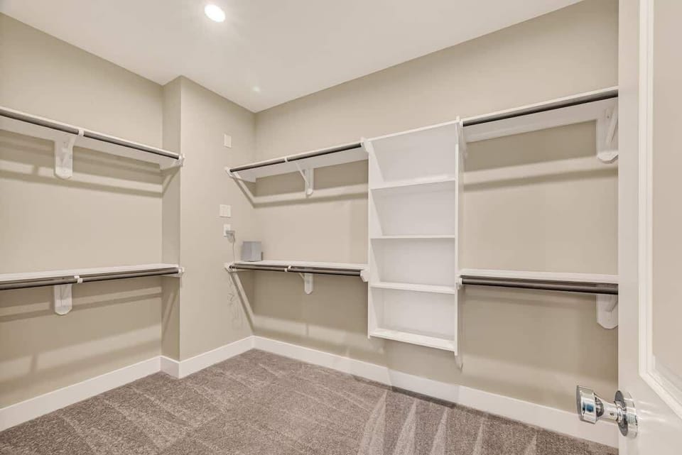 Walk-in Closet: Organize your wardrobe in style with custom shelving and ample space!