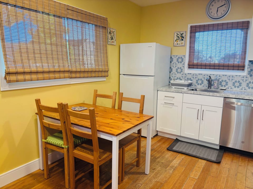 Kitchen table for dining or working with easy pull down shades.