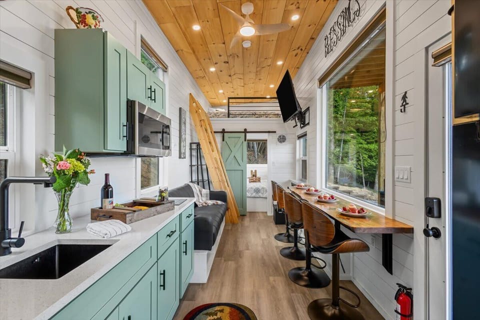 Full living area: kitchen, dining and living