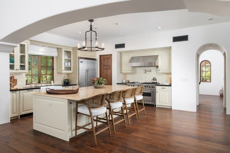 Thoughtfully designed for both gathering and gourmet cooking, this stunning chef’s kitchen opens seamlessly into the expansive living space, creating the perfect setting for effortless entertaining.