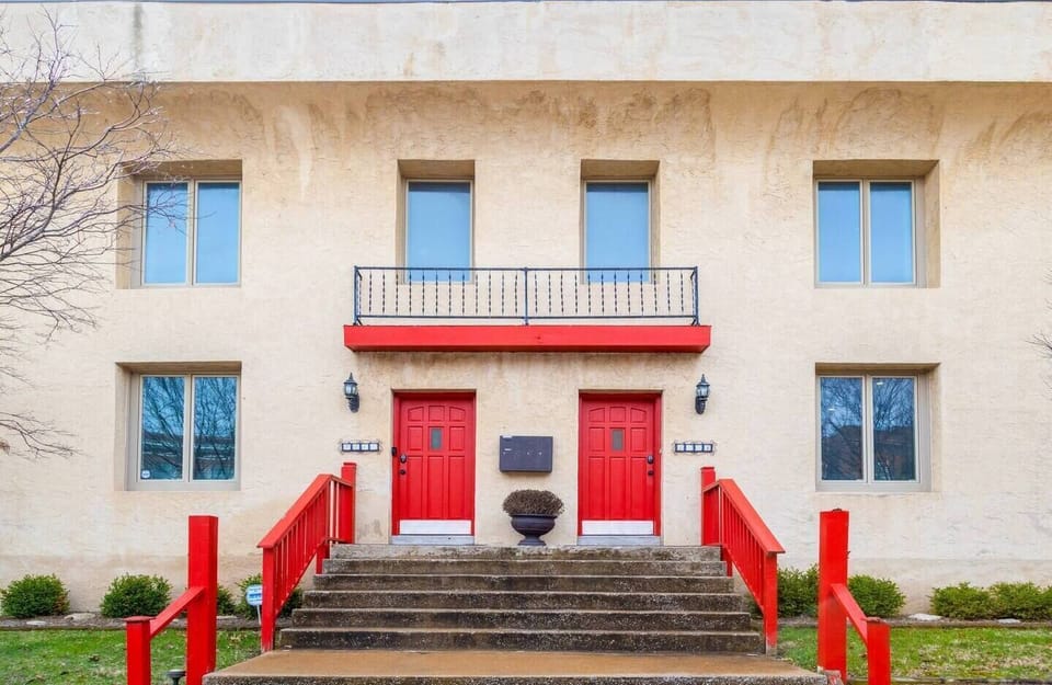 The exterior of the building.  You'll enter through the red door on the left!