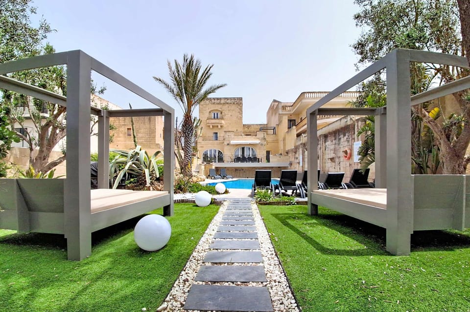 Outdoor garden area with sun loungers