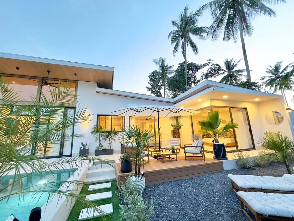 Stylish villa exterior with sloped roof and tropical garden – Villa Amala, 3BR private pool villa Koh Samui.