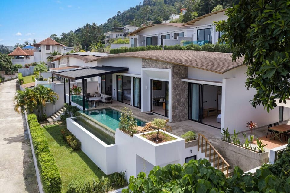 Tropical landscaped gardens and covered terrace at Villa Ombra, a luxury Koh Samui holiday rental