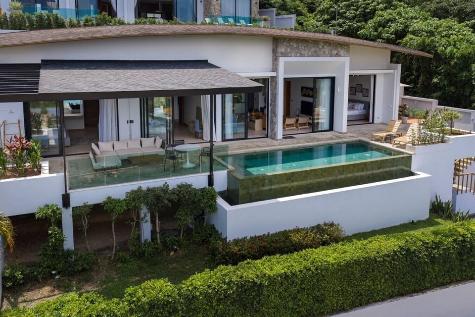 Modern luxury villa exterior with infinity pool and sea views in Koh Samui, Thailand