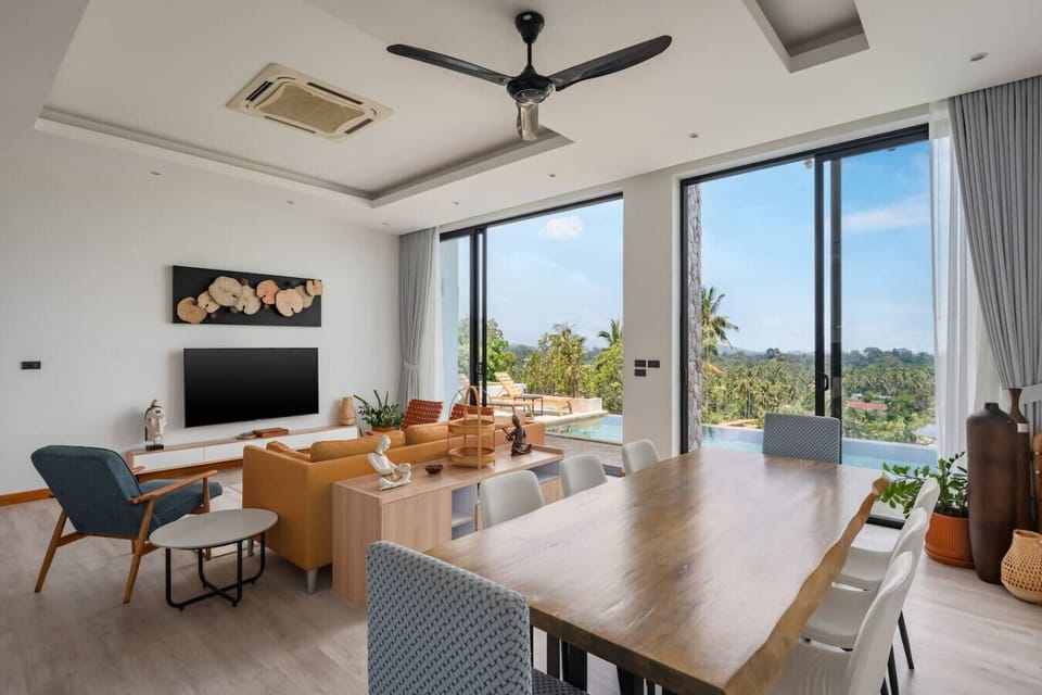 Open-plan dining area with sea views and modern design at Villa Ombra, Mae Nam Thailand