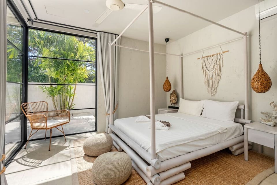 Spacious bedroom with queen bed and elegant decor