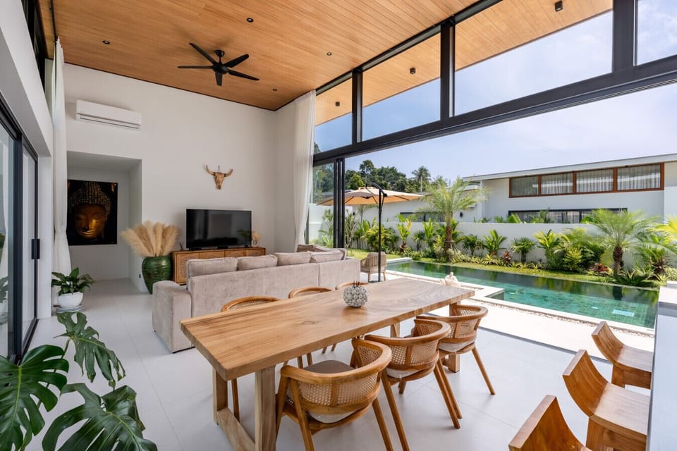 Open-air living area with vaulted wooden ceiling in luxury Bophut pool villa