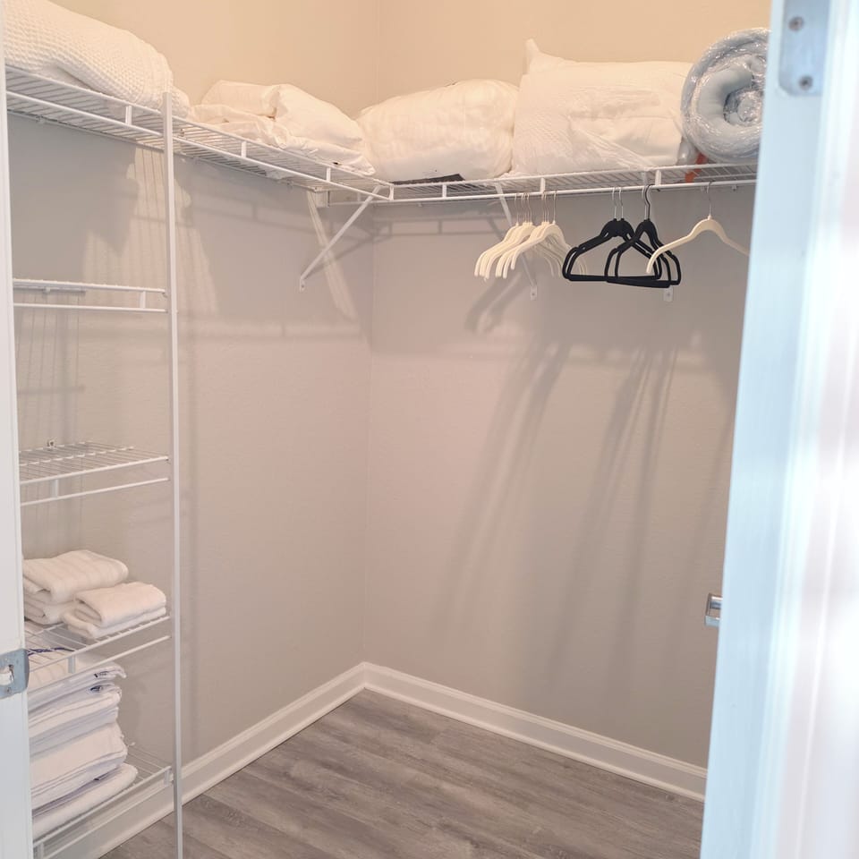 Main room's walk in closet with optional mattress pads and winter blankets