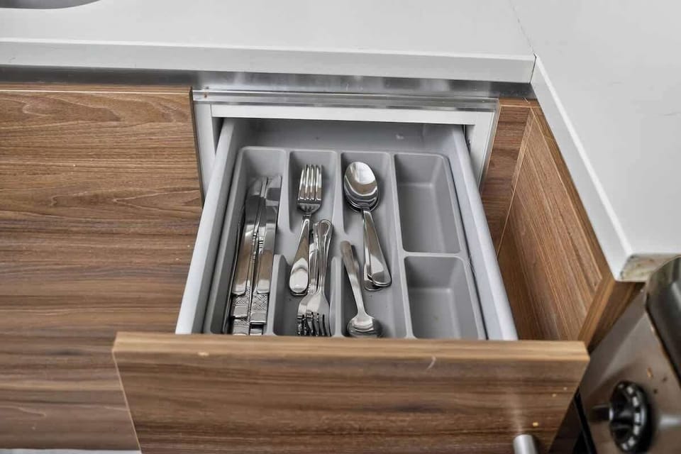 Organized drawers with complete utensils and cookware - no guessing where things are when cooking