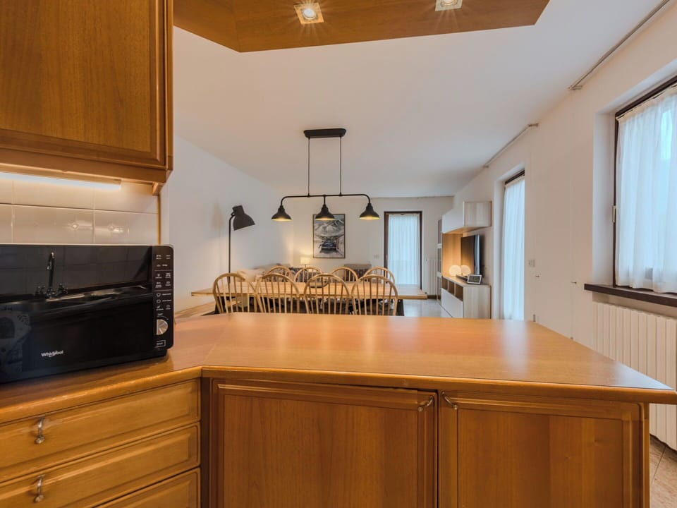 Kitchen, Interior Design, Countertop, Cabinetry, Furniture, Wood, Ceiling, Light Fixture, Flooring, Kitchen Appliance