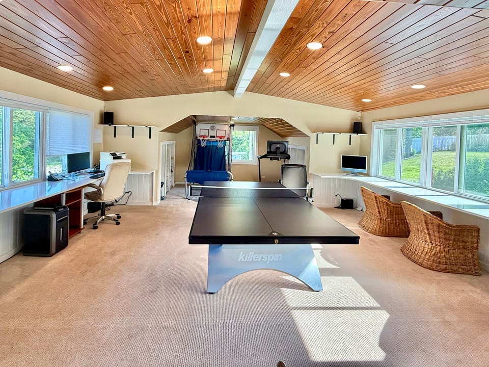 Great office area with ping pong table, pop-a-shot, and Peloton tread. 