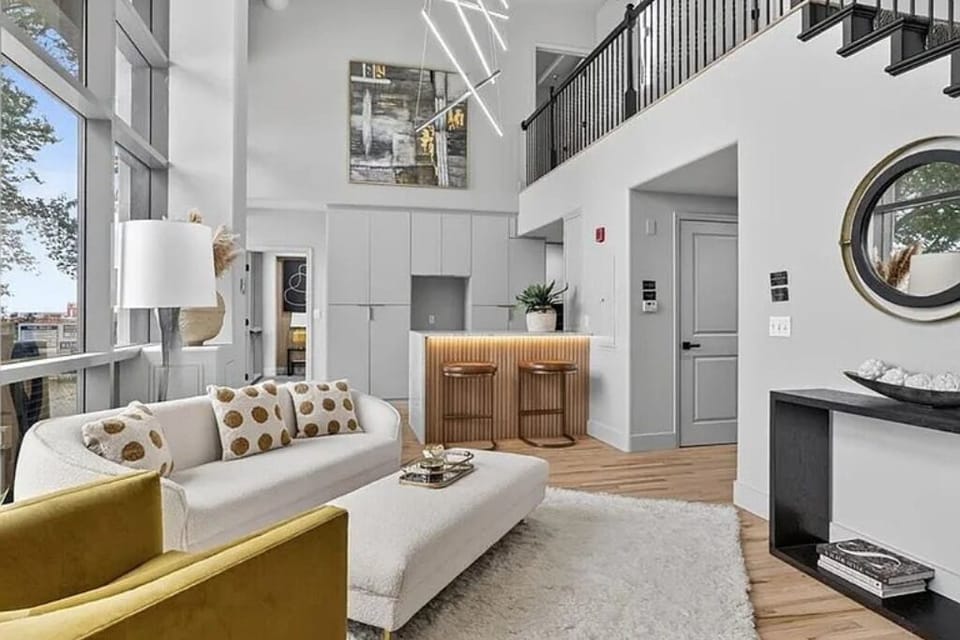 Bright, airy living room with soaring ceilings and elegant modern style.