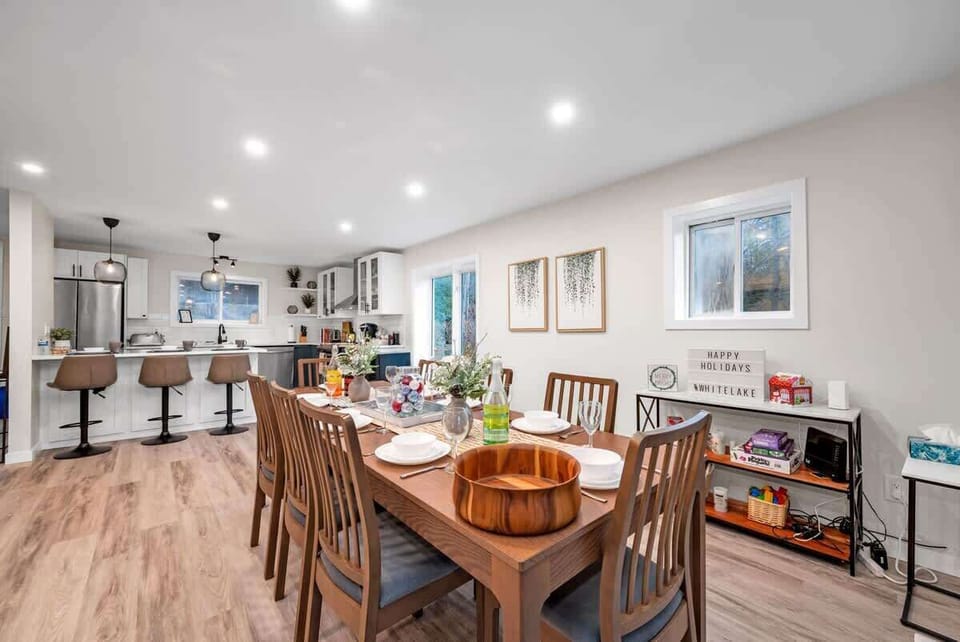 Open concept kitchen with ample seating! Sit 8 at the table, 3 at the counter and can't forget the high chair! 