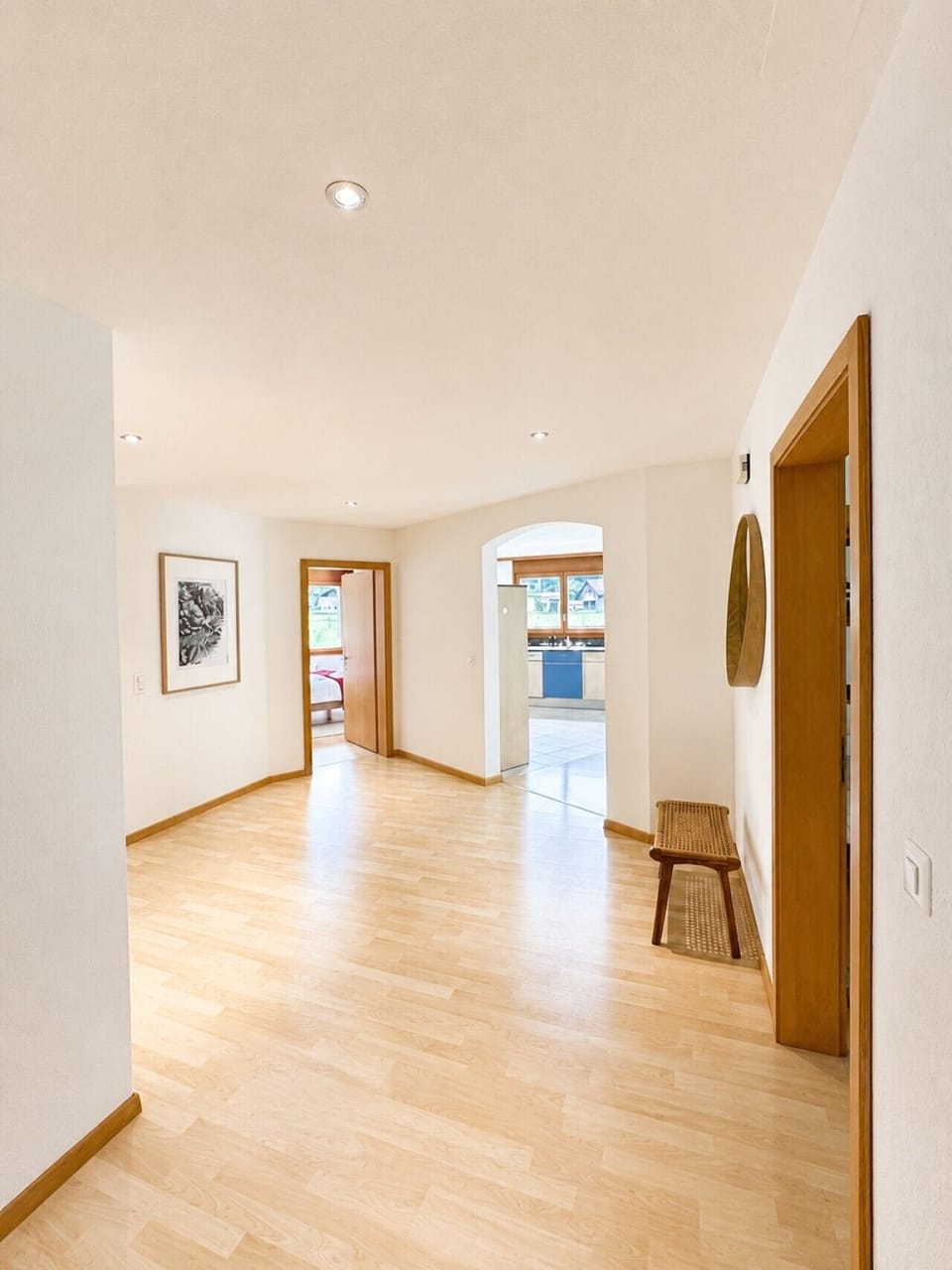 Manor 2 corridor — bright step-free access connecting bedrooms, kitchen and living spaces for easy family stays.